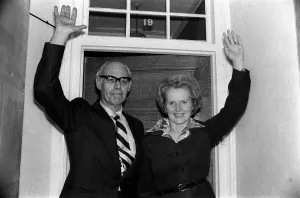 Conservative politician Margaret Thatcher waves at the front door of her home with Conservative politician Margaret Thatcher waves at the front door of her home with
