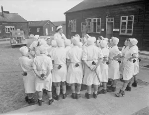 Cooks from the Womens Royal Army Corps (WRAC) seen here on parade. 26th October 1952 Cooks from the Womens Royal Army Corps (WRAC) seen here on parade. 26th October 1952