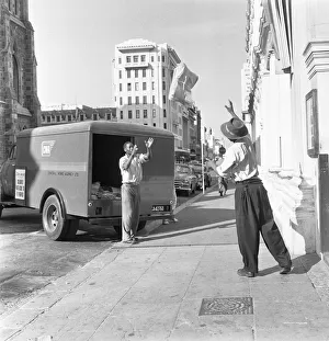Copies of The Cape Argus are tossed to waiting delivery van in Capetown 4th February 1955 Copies of The Cape Argus are tossed to waiting delivery van in Capetown 4th February 1955
