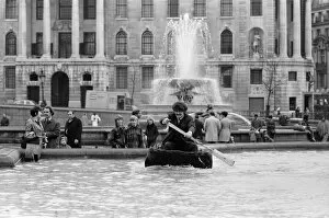 Images Dated 1st April 1972: Coracle fishermen in London. One of the fishermen paddles his coracle round Trafalgar