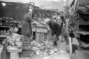 Council workers clear away the waste fruit and veg from around Kingston markets green Council workers clear away the waste fruit and veg from around Kingston markets green