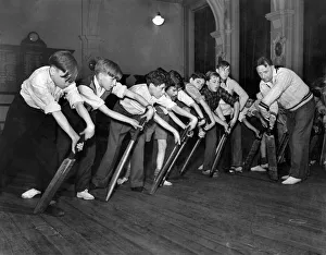 Cricket Coaching. Boys follow Mr. Moseley's example in this forward shot Cricket Coaching. Boys follow Mr. Moseley's example in this forward shot