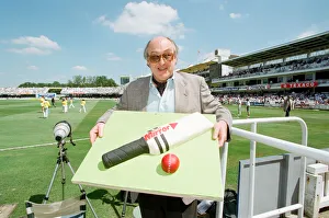 Cricket commentator Henry Blofeld is presented with a Daily Mirror cake in the shape of a Cricket commentator Henry Blofeld is presented with a Daily Mirror cake in the shape of a