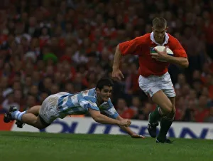 Dafydd Jones Hughes breaks through in October 1999, during the Wales v Argentina rugby Dafydd Jones Hughes breaks through in October 1999, during the Wales v Argentina rugby