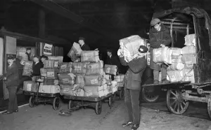 Daily Mirror newspapers being loaded on to a Liverpool bound train at Euston Station Daily Mirror newspapers being loaded on to a Liverpool bound train at Euston Station