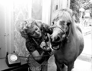 Images Dated 1st June 1974: Dally the Shetland Pony and her owner Olga Denver stand in the hallway of her home as