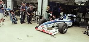 Images Dated 13th July 1997: Damon Hill of Arrows-Yamaha, leaving garage, 1997 British Grand Prix