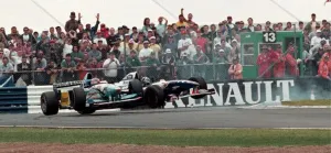 Damon Hill in a Williams and Michael Schumacher in a Beneton collide in the British Grand Damon Hill in a Williams and Michael Schumacher in a Beneton collide in the British Grand