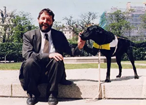 David Blunkett sitting outside Houses of Parliament with guide dog 26/05/1994 David Blunkett sitting outside Houses of Parliament with guide dog 26/05/1994