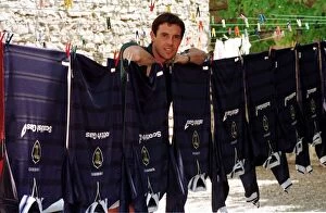 Images Dated 18th June 1998: David Weir posing beside a washing line holding Scotland tops during the World Cup