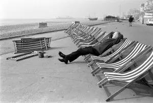 Deck chair tester Ernie Snelling. Its hard work down at the seaside doing the deck chair Deck chair tester Ernie Snelling. Its hard work down at the seaside doing the deck chair