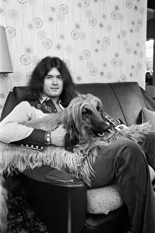 Deep Purple guitarist Glenn Hughes relaxes with his pet Afghan hound Khama after Deep Purple guitarist Glenn Hughes relaxes with his pet Afghan hound Khama after