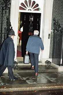 Denis Thatcher carries a suitcase into 10 Downing Street following the Prime Minister' Denis Thatcher carries a suitcase into 10 Downing Street following the Prime Minister'