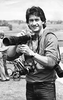 Dennis Mortimer, Aston Villa captain when they won the European Cup. Holding a camera Dennis Mortimer, Aston Villa captain when they won the European Cup. Holding a camera