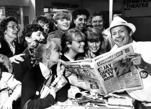DJ Billy Butler shows off the new style of tabloid Liverpool Echo to visitors to the Echo DJ Billy Butler shows off the new style of tabloid Liverpool Echo to visitors to the Echo