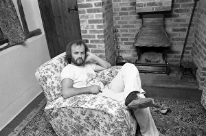 DJ John Peel at home sitting in lounge 1975 John Peel BBC Radio 1' DJ John Peel at home sitting in lounge 1975 John Peel BBC Radio 1'