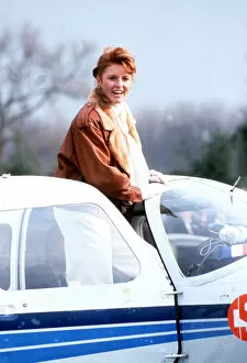 Images Dated 12th February 1987: Duchess Of York getting out of her private plane to receive her private pilot