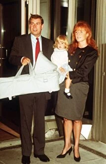 Images Dated 1st May 1990: Duke And Duchess Of York with their Children Beatrice and Eugenie in her Carry-Cot