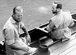 The Duke of Edinburgh and Lieutenant-Commander Parker in a canoe during his visit to The Duke of Edinburgh and Lieutenant-Commander Parker in a canoe during his visit to