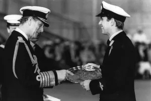 The Duke of Edinburgh. Prince Philip presents the Louis Newmark trophy to his son The Duke of Edinburgh. Prince Philip presents the Louis Newmark trophy to his son