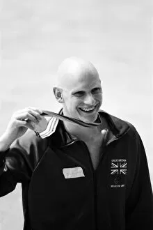 Images Dated 22nd July 1980: Duncan Goodhew swimmer takes part in medal ceremony after winning gold medal in Men