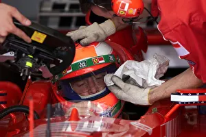 Eddie Irvine gets some personal attention in the pits The 1999 British Grand Eddie Irvine gets some personal attention in the pits The 1999 British Grand