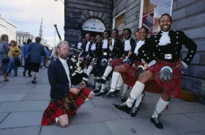 Edinburgh Festival August 1989 Black Theatre Company with piper Sandy Davidson Edinburgh Festival August 1989 Black Theatre Company with piper Sandy Davidson