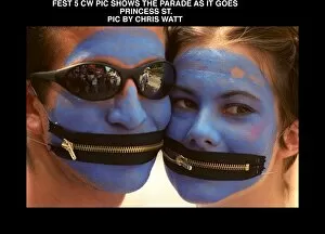 Images Dated 10th August 1997: Edinburgh Festival Parade painted blue faces August 1997 With zip fasteners for mouths
