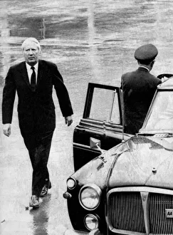 Edward Heath walking in the rain to official car - December 1972 Edward Heath walking in the rain to official car - December 1972