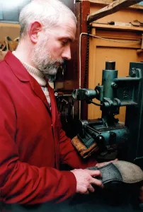 Edwin Macklow, second generation cobbler at work in his fathers shop Edwin Macklow, second generation cobbler at work in his fathers shop