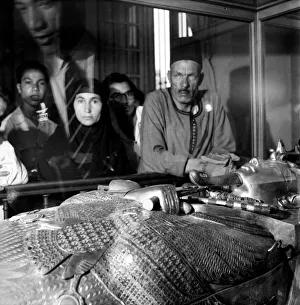 Egyptian: Tourists gaze at the mummy of King Tutan Khamen Egyptian: Tourists gaze at the mummy of King Tutan Khamen