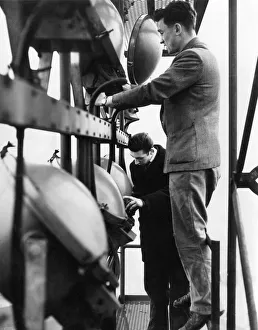 Electricians checking the lights in one of the 114ft floodlight towers at St Andrews Electricians checking the lights in one of the 114ft floodlight towers at St Andrews