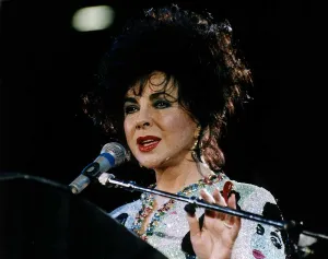 Elizabeth Taylor Actress At Freddy Mercury Aids Concert talking into mike Elizabeth Taylor Actress At Freddy Mercury Aids Concert talking into mike