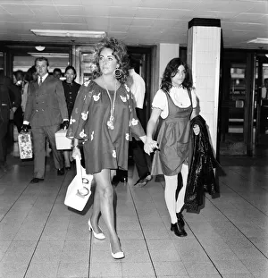 Elizabeth Taylor and Richard Burton with daughter Liza leave London Airport (Heathrow Elizabeth Taylor and Richard Burton with daughter Liza leave London Airport (Heathrow