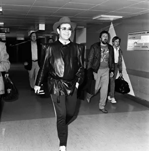 Elton John arriving at Heathrow airport from Copenhagen. 7th May 1982 Elton John arriving at Heathrow airport from Copenhagen. 7th May 1982