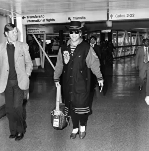 Elton John arriving at Heathrow Airport from Perth. 23rd December 1980 Elton John arriving at Heathrow Airport from Perth. 23rd December 1980