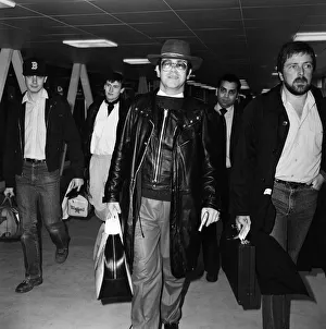 Elton John at Heathrow airport. 7th February 1982 Elton John at Heathrow airport. 7th February 1982