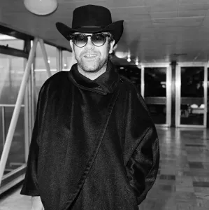 Elton John at Heathrow Airport for a flight to New York. 11th January 1981 Elton John at Heathrow Airport for a flight to New York. 11th January 1981