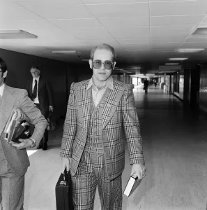 Elton John leaving Heathrow Airport for Helsinki where he will be for one day to watch Elton John leaving Heathrow Airport for Helsinki where he will be for one day to watch