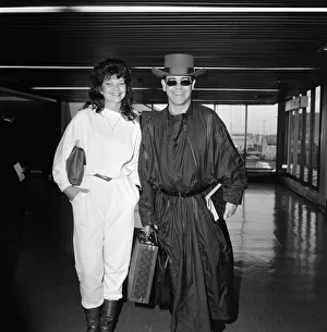 Elton John and his new wife Renate arriving at Heathrow Airport from Hong Kong Elton John and his new wife Renate arriving at Heathrow Airport from Hong Kong