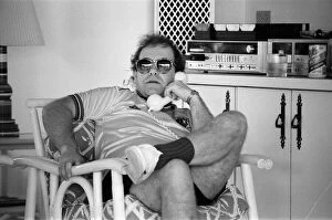 Images Dated 11th October 1982: Elton John wearing a Watford F. C. shirt on the Caribbean island of Montserrat