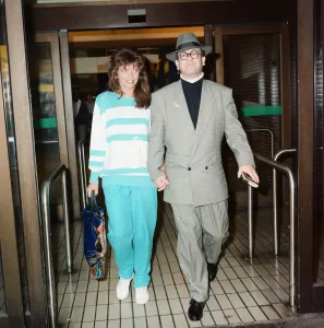 Elton John and his wife Renate at London Airport. 29th July 1988 Elton John and his wife Renate at London Airport. 29th July 1988