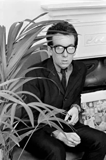Images Dated 10th August 1977: Elvis Costello, the newest sensation on the music scene, sitting next to plant