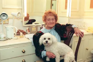 Emily Perry sitting in her dressing room with her dog, West End production of Dame Edna Emily Perry sitting in her dressing room with her dog, West End production of Dame Edna
