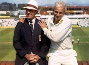 Images Dated 6th July 1992: England cricketer David Gower sitting on a brick wall with commentator