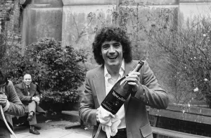 England footballer Kevin Keegan poses for photographers holding a large champagne bottle England footballer Kevin Keegan poses for photographers holding a large champagne bottle