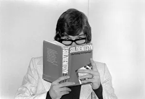 England footballer Malcolm MacDonald clowns around with glasses whilst reading " England footballer Malcolm MacDonald clowns around with glasses whilst reading "