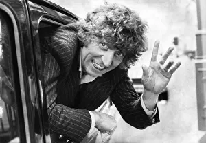 English actor Tom Baker waving from the back of a taxi. October 1980 P003678 English actor Tom Baker waving from the back of a taxi. October 1980 P003678
