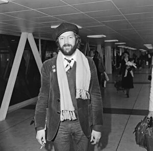 Images Dated 26th March 1979: Eric Clapton pictured leaving Heathrow airport for California