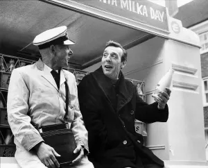 Eric Sykes Comedy Actor Comedian being shown by his milkman Harry Smith how it's done Eric Sykes Comedy Actor Comedian being shown by his milkman Harry Smith how it's done